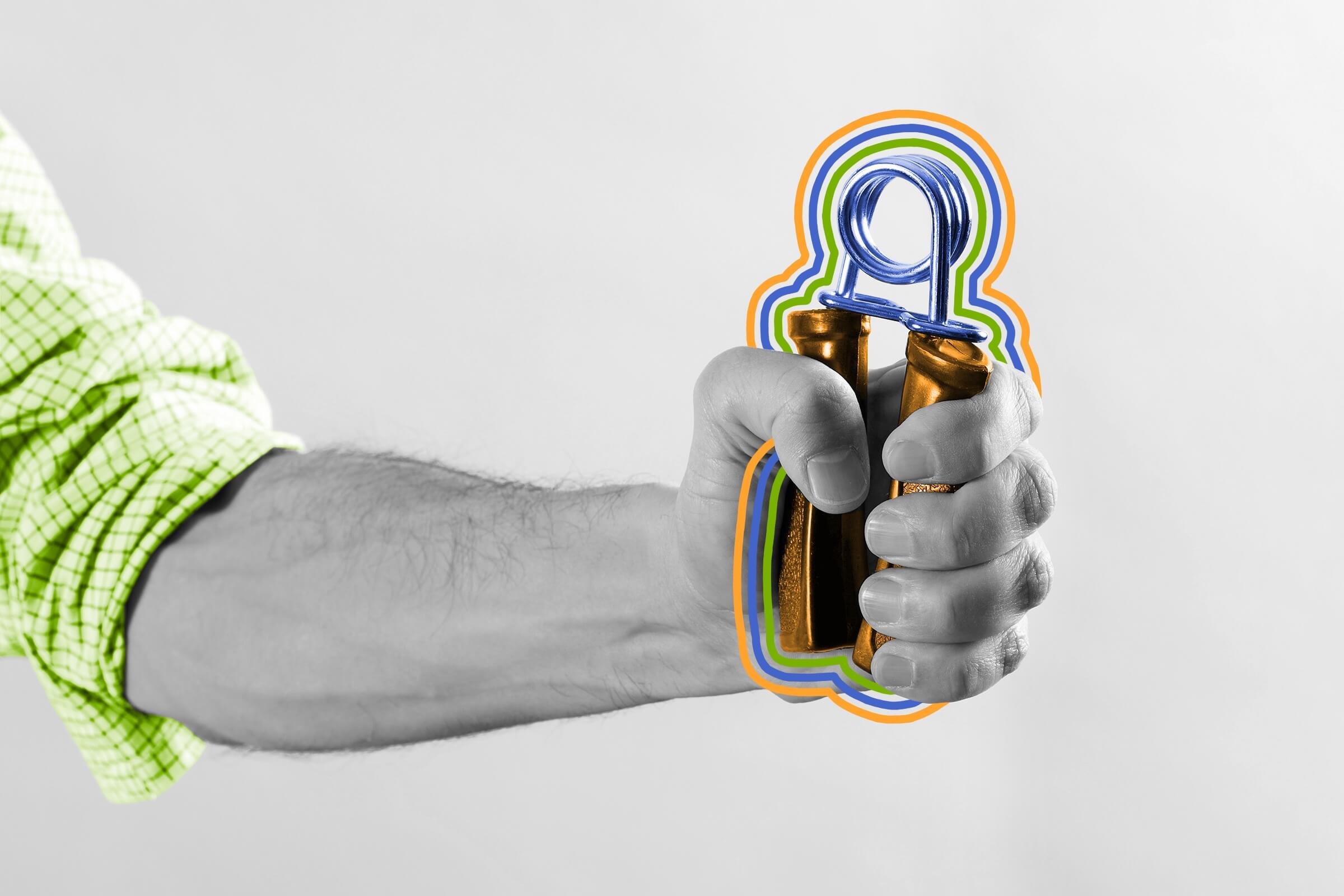 Close-up of a man gripping a hand exercise gripper