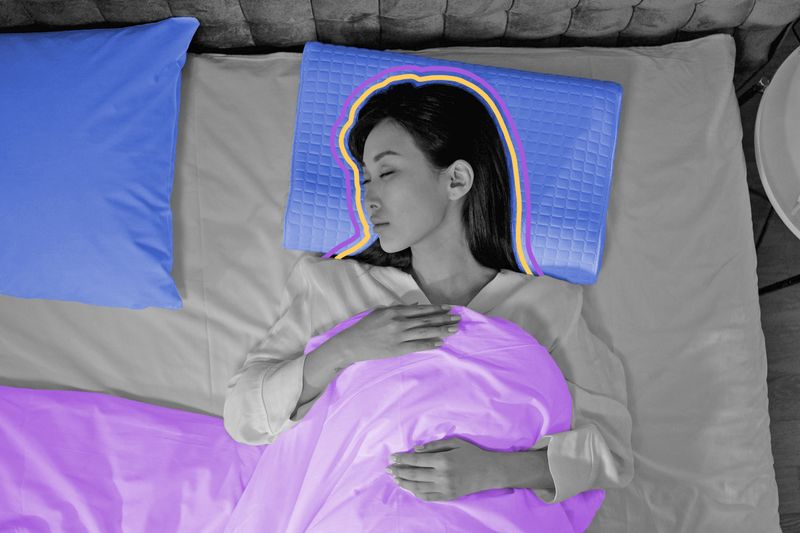 Calm and peaceful woman sleeping in bed